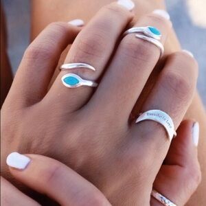 silver and turquoise 3 ring set. 2 eclipse silver toned rings and one blue.NWT